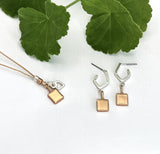 Solid square pendant on angled stud earring