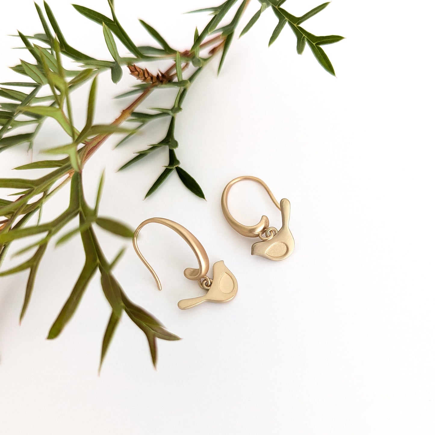 Winged bird on chunky hook earring