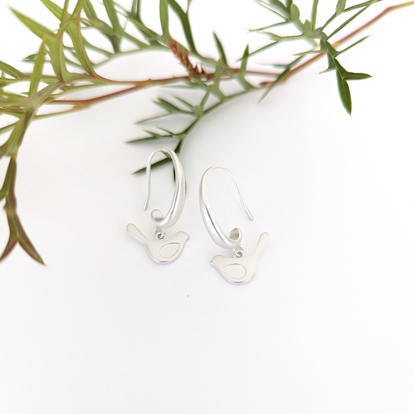 Winged bird on chunky hook earring