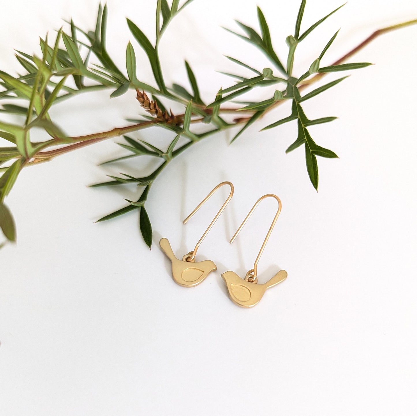 Winged bird on short straight hook earring