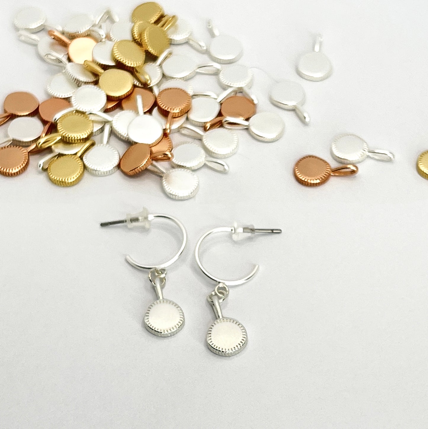 Round drop pendant on hoop stud earrings