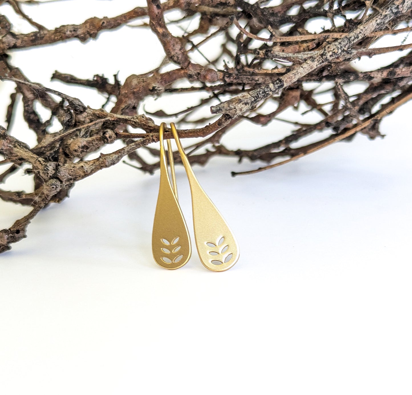 Leaf cut-out spoon earrings