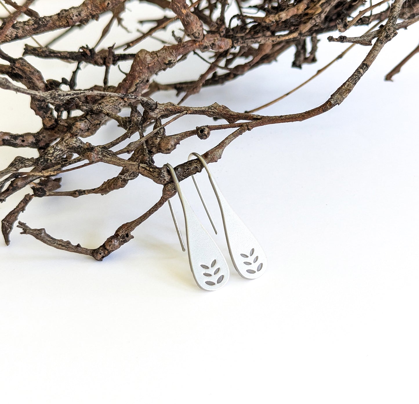 Leaf cut-out spoon earrings