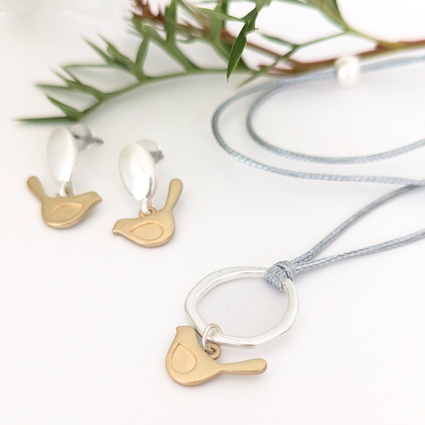 Winged bird flat ring cord necklace