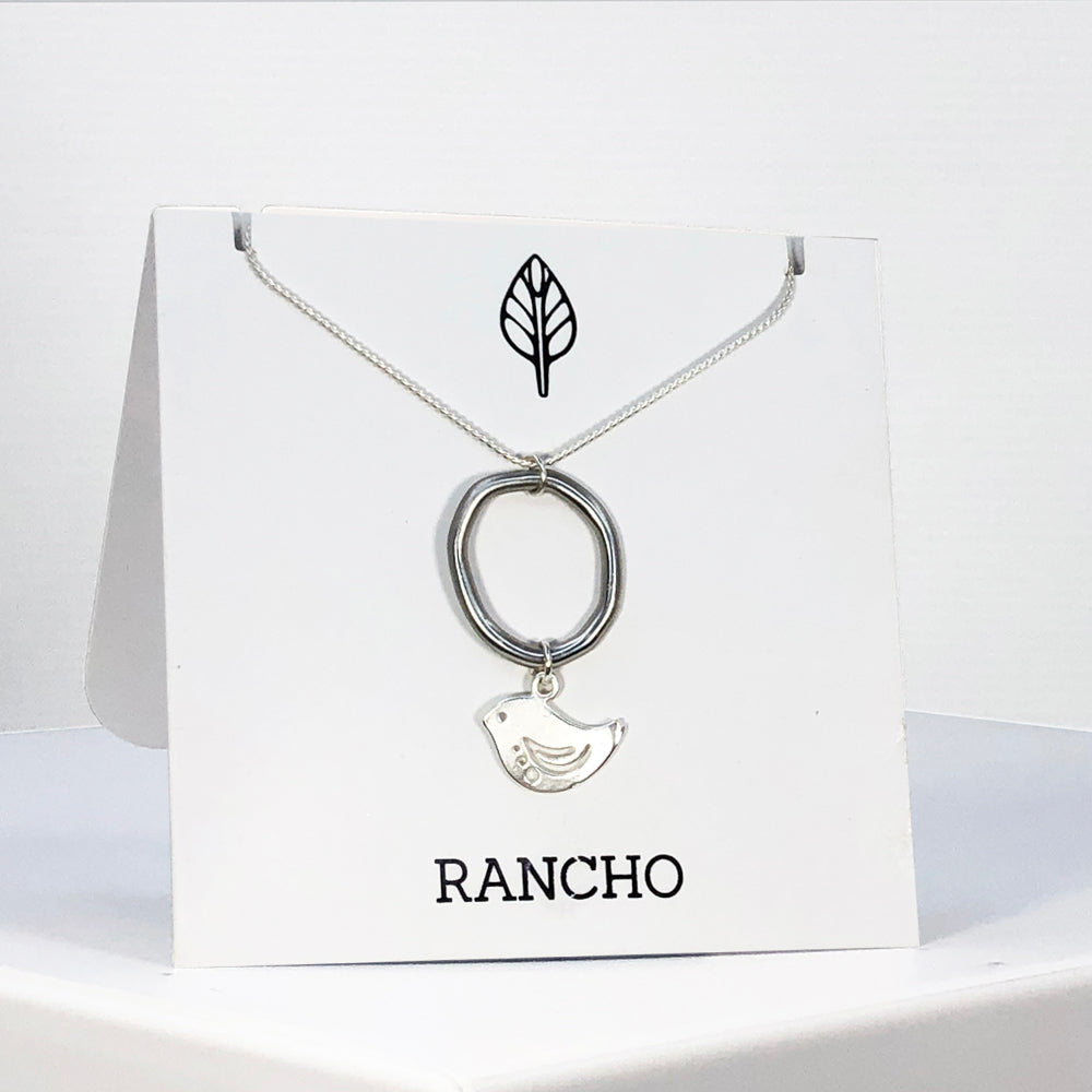 Ring and bird on silver chain necklace