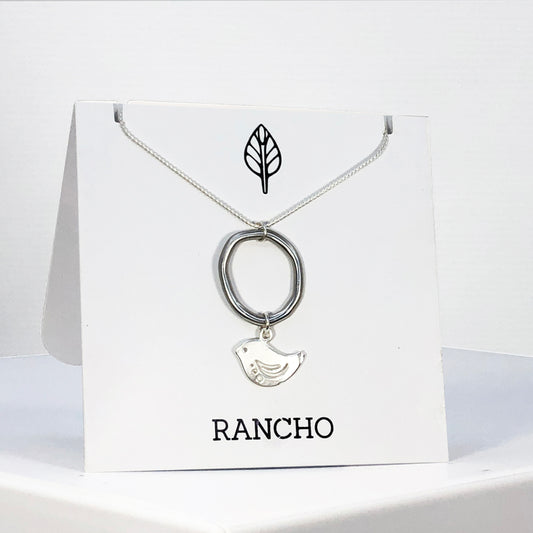 Ring and bird on silver chain necklace